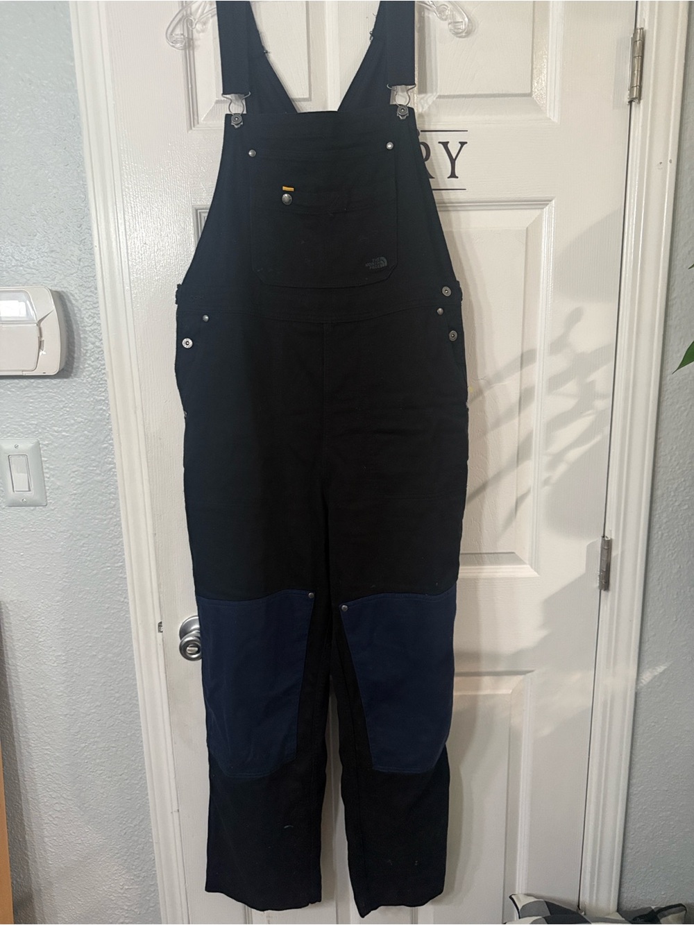 The North Face Men's Black Overalls with Blue Knee Panels